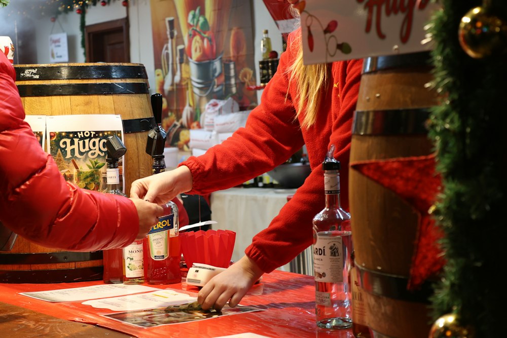 Buying a festive drink at a Christmas market stall